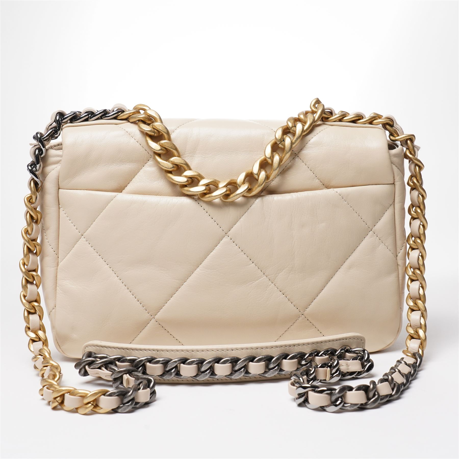 Chanel - ‘19’ Medium Flap Bag, the model introduced in 2019 as one of the final designs associated with Karl Lagerfeld, in cream quilted lambskin leather with mixed gold, silver and ruthenium-tone chain strap and signature CC monogram turn-lock fastening, unused with original dust bag and box