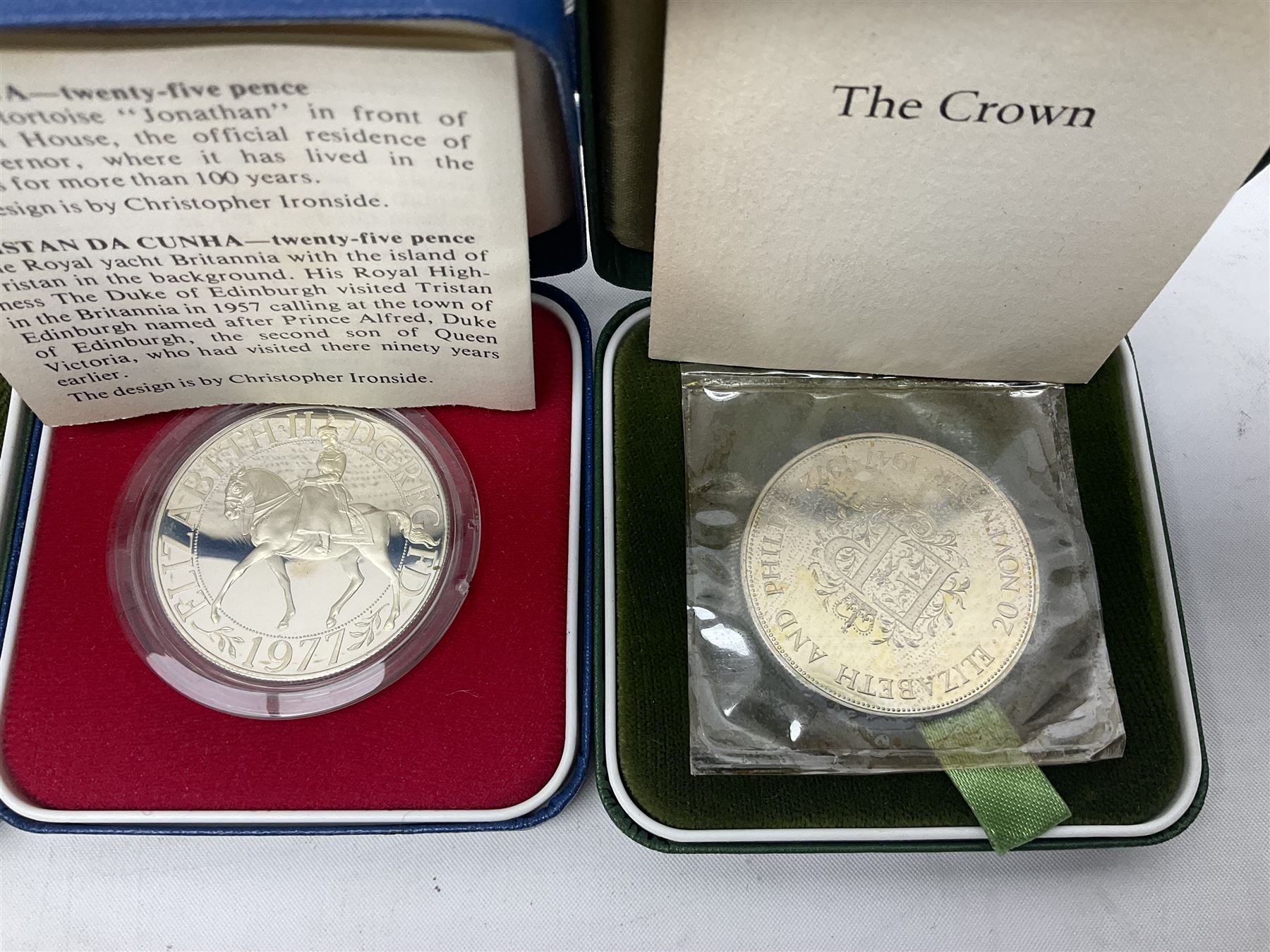 Seven The Royal Mint United Kingdom sterling silver proof crown coins, comprising two 1972, three 1977, 1981 and 1993, all cased with certificates and a Queen Elizabeth II 2001 one ounce fine silver Britannia coin on card (8)