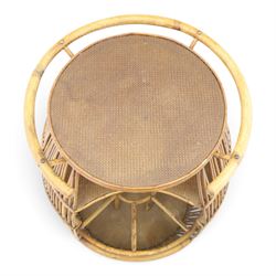 Italian mid-20th century barrel-shaped bar cart in rattan and bamboo, the circular top with rattan and bamboo handle, above a rattan shelf with bamboo bottle dividers below, raised on castors
