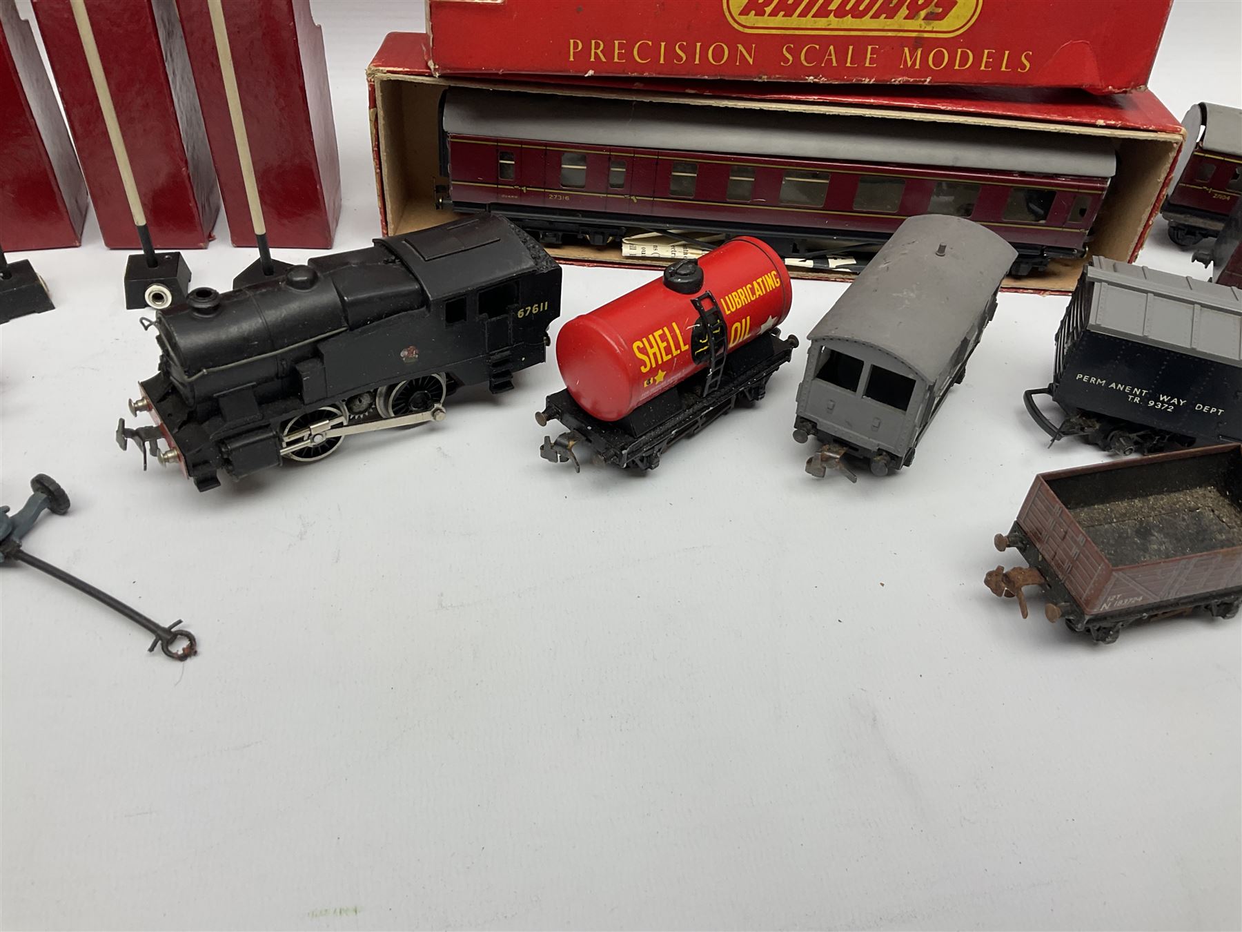 Trix Twin Railway - Hunt Class 4-4-0 locomotive and tender 'Pytchley' No.62750, boxed; 0-4-0 tank locomotive with plastic body No.67611; three passenger coaches (one boxed); six goods wagons; three boxed Yard Lamps etc; and Tri-ang Track Cleaning Car, boxed