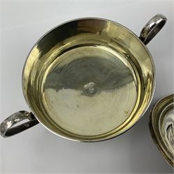 Early/mid 20th century Persian silver tea service, comprising circular serving tray, teapot, twin handled sucrier and cover, milk jug, five tea glasses with six silver holders, six tea spoons, and pair of sugar tongs, each profusely chased with foliate arabesque decoration, each bearing marks including 84 for 840 fineness, tray D40cm, teapot H16cm