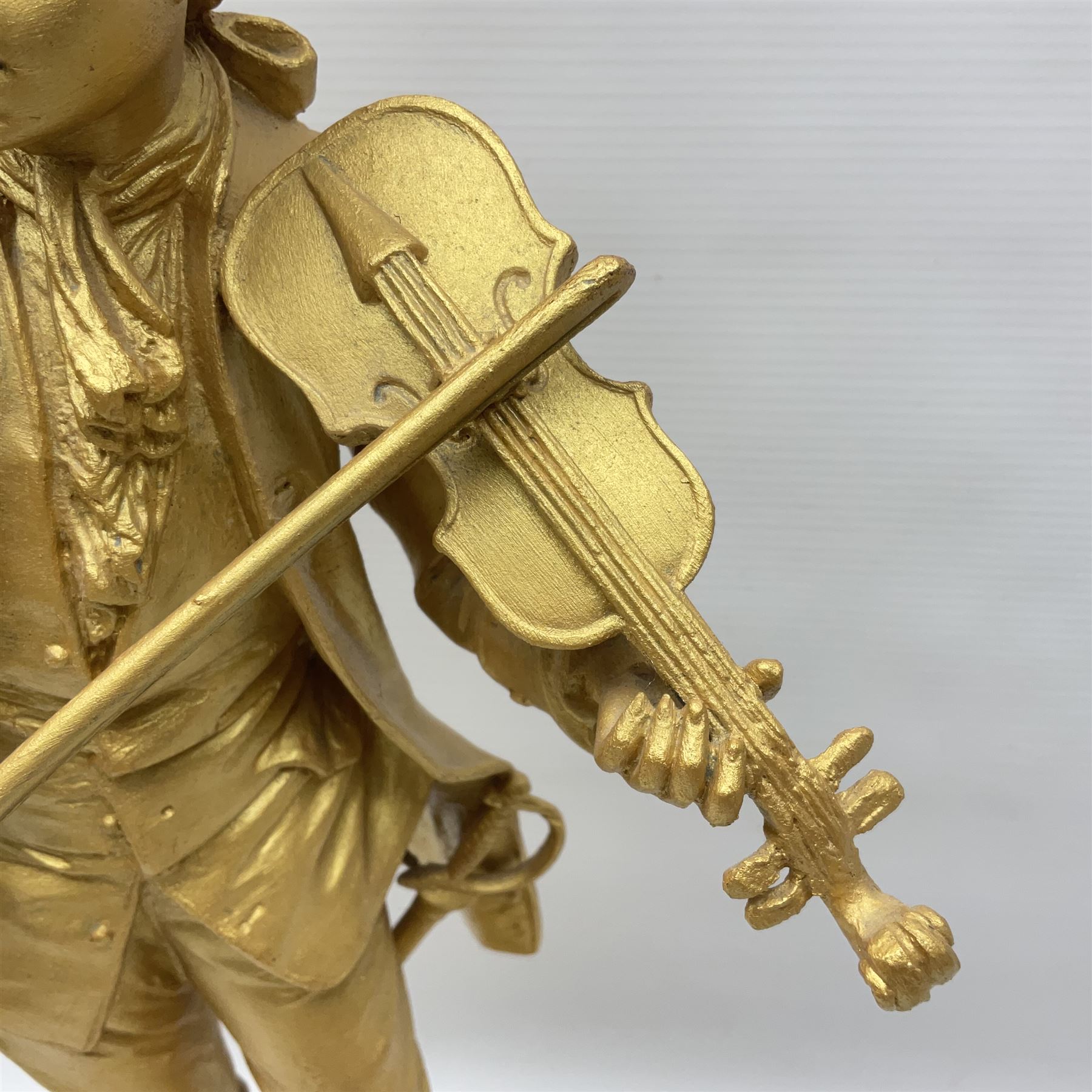 After Émile Bruchon, Mozart, gold painted figure upon a wooden plinth, H51cm