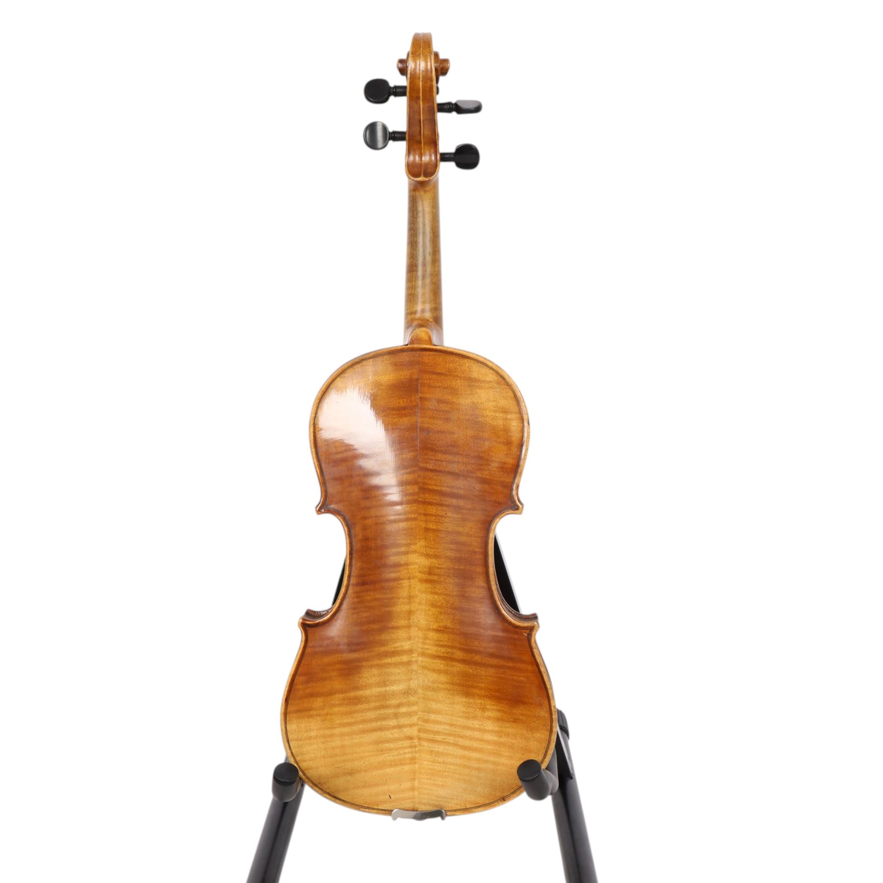 Two 19th century violins, each with two piece maple backs, ebonised wooden pegs and finger boards and modern plastic chin rests, with two bows, all contained within a modern two-violin soft case with red interior
