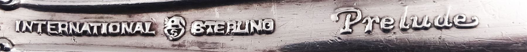 20th century American silver Prelude pattern baby spoon and fork set, with foliate detail to terminals, marked International Sterling Prelude, together with three further 20th century American silver baby spoons, the first example marked Gorham Sterling, and a pair marked International Sterling, approximate total silver weight 3.13 ozt (97.4 grams)