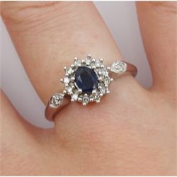 9ct white gold oval sapphire and round brilliant cut diamond cluster ring, with diamond set shoulders, hallmarked 