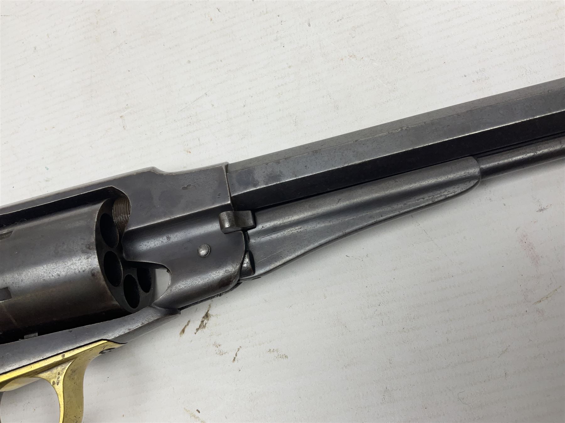 Unmarked Spencer & Rogers type Remington style .44 cal. six-shot percussion revolver, 20cm octagonal barrel with loading lever under, brass trigger guard and two-piece wooden grip L37cm overall; together with a framed watercolour by Alan J. Gray dated 2009 entitled 'The Remington .44 Calibre 1861 Navy Revolver'  19 x 42cm (2)