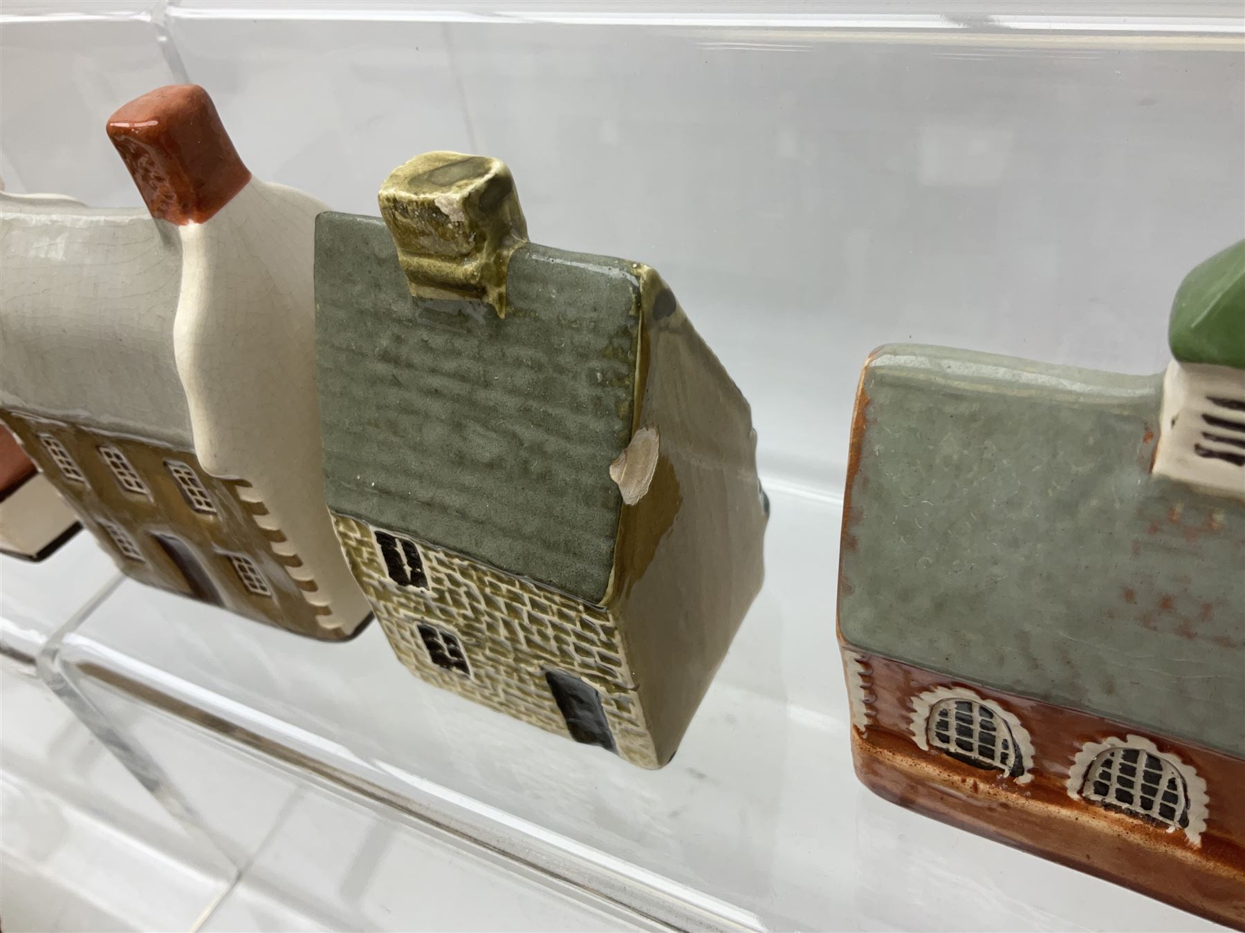 Twenty studio pottery figures of houses and cottages, comprising seventeen Mudlen End Studio Felsham Suffolk examples and two John Putman's Heritage Houses examples