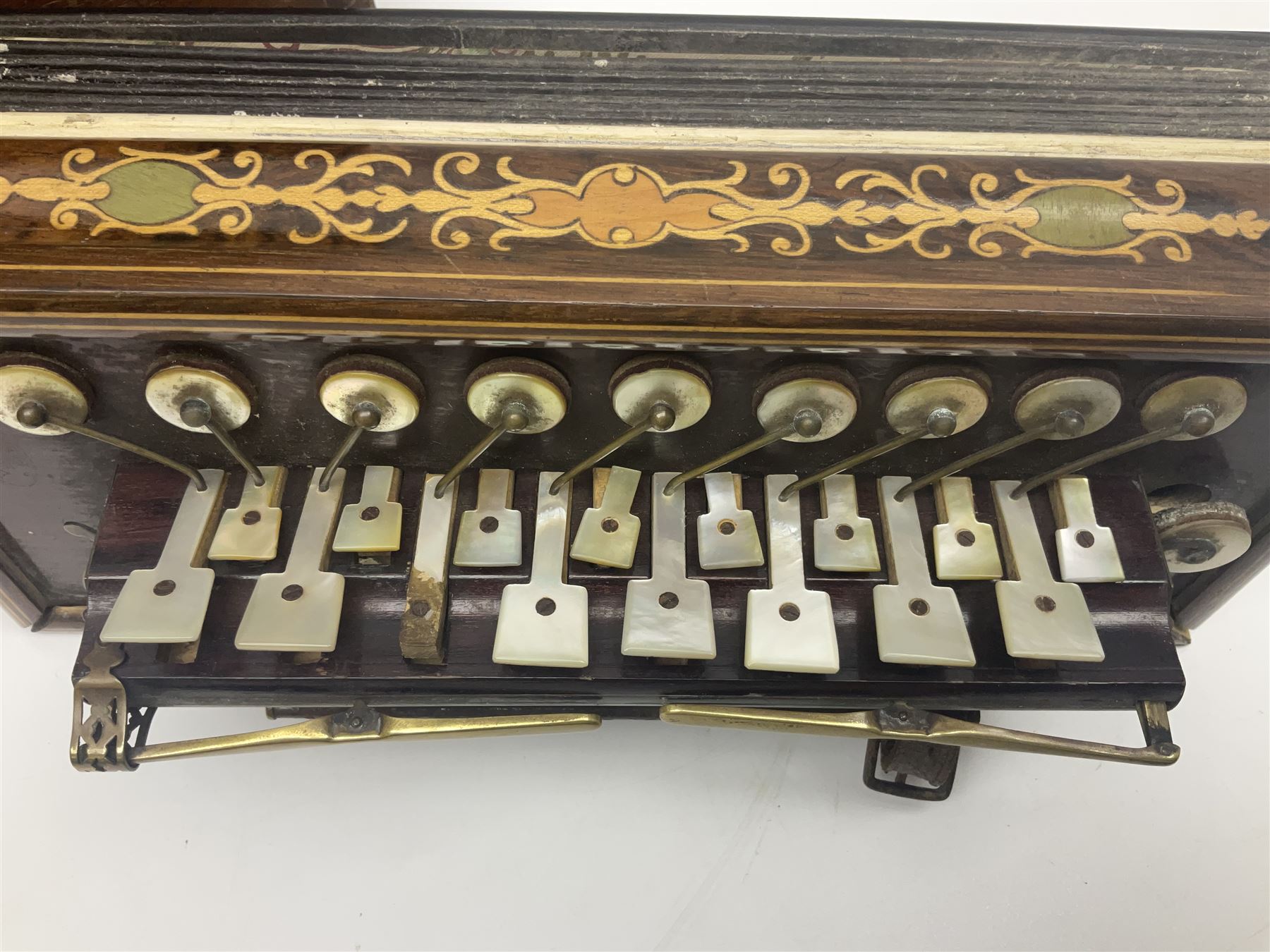 19th Century inlaid rosewood Flutina accordion, stamped Busson of Paris, having sixteen mother of pearl keys and six fold floral decorated bellows L30cm; in baize lined mahogany box