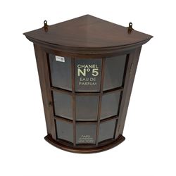 20th century mahogany bow front corner display cabinet, decorated with Chanel lettering