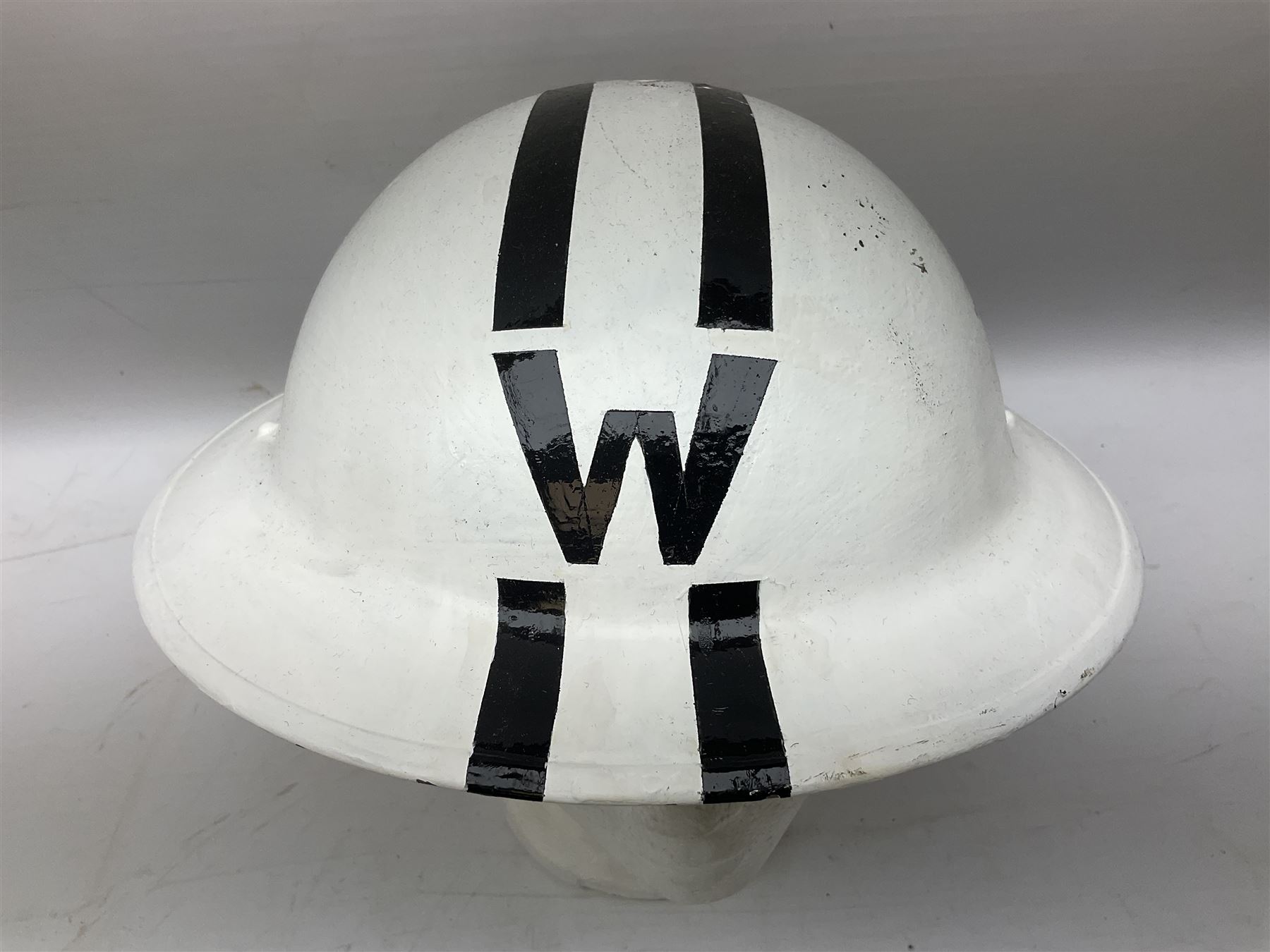 WW2 Home Front 'Police' black painted steel helmet with original liner and webbing chin strap, impressed R.O. Co. 1/1939; and re-painted shell only for WW2 Wardens steel helmet impressed AMC II 1941 C676 (2)
