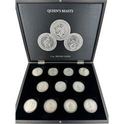 Eleven Queen Elizabeth II 'Queen's Beasts' two ounce fine silver coins, including 2016 'Lion of England', 2017 'Griffin of Edward', 2018 'Black Bull of Clarence' etc, housed in a display case