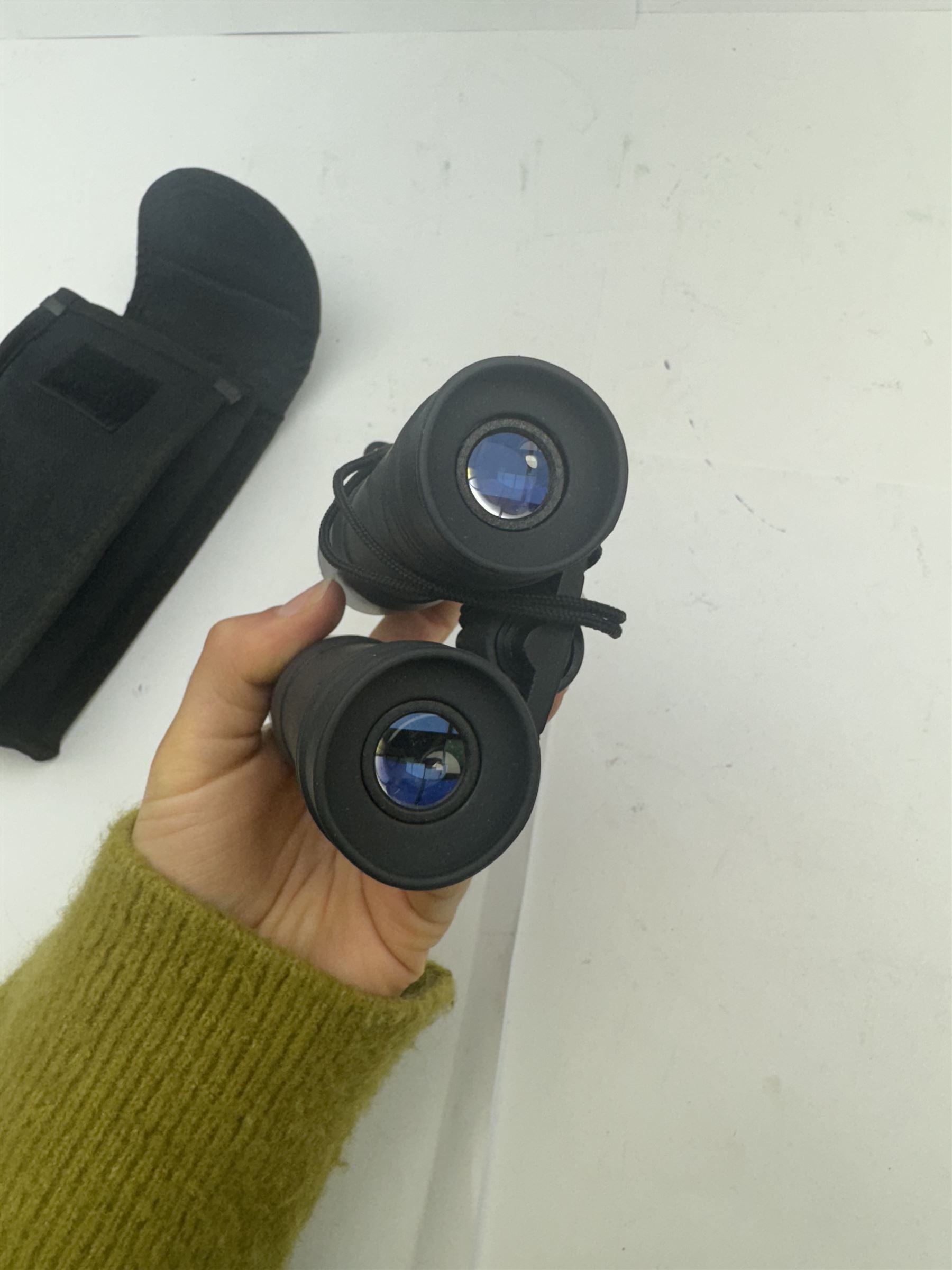 Four pairs of binoculars, to include Carl Zeiss Jena Jenoptem 8x30W serial no. 3750814, Nikon Sporting II 8x40 serial no. 604672, Minolta Pocket II 8x22 Field 7 and Jessops 12x25 Field 4.8 84m/1000m, all in carrying cases 