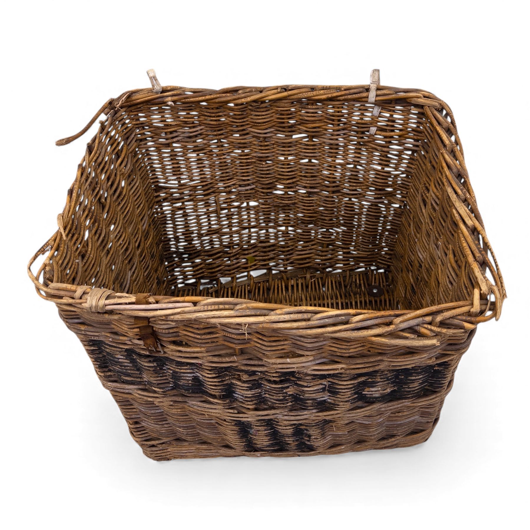 Large 20th century wicker laundry basket, of rectangular form, with stencilled lettering to one sides, raised on wooden base skids