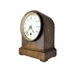 French - late 19th century 8-day walnut table clock, with a round top and shallow plinth raised on block feet, enamel dial with Roman numerals and minute track and decorative pierced steel hands within a gilt slip and cast brass bezel, single train movement with a spring driven going barrel. With pendulum. 