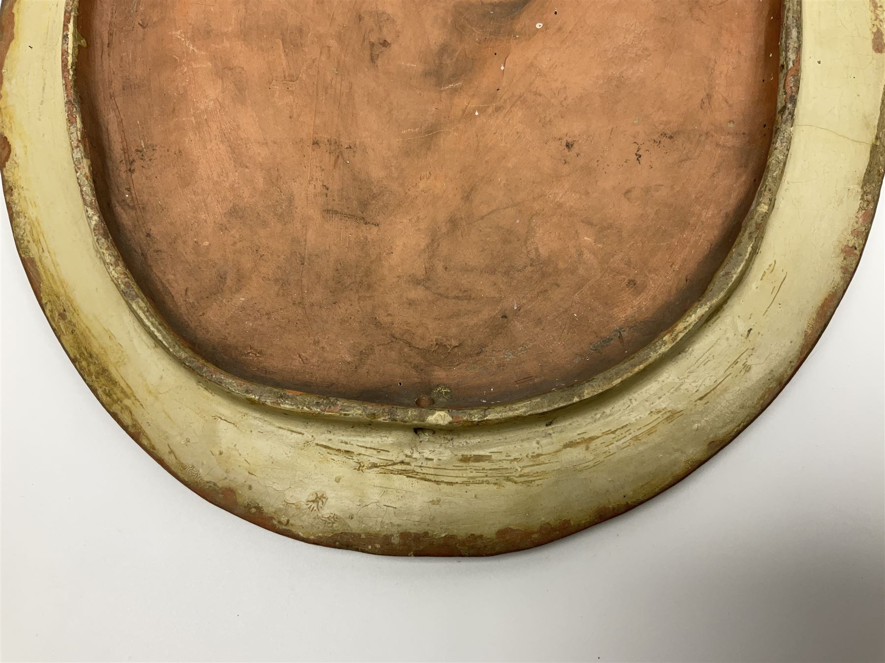 Pair of 19th century classical terracotta relief wall plaques depicting the goddess Hygeia and another goddess, seated holding an ewer, each of oval form, indistinctly signed, each stamped Ferreira verso, H42cm, W30cm