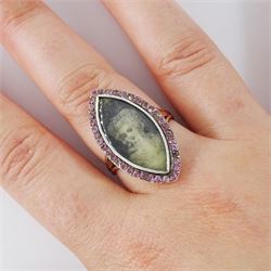 18th / 19th century gold and silver paste stone set portrait ring, the navette bezel set with a miniature of a woman on ivory, under a glazed panel, within a pink paste border and trifurcated shoulders. This lot has been registered for sale under Section 10 of the APHA Ivory Act