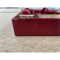 19th century walnut and brass bound games compendium box, painted to enhance the grain, of rectangular form, the hinged opening cover with rounded sides, central brass cartouche with engraved lion crest, and brass riveted straps, opening to reveal a red leather and blue silk lined compartmented interior, with fold-down games board, and lift-out tray containing playing cards, ebony turned dice towers, white and red stained bone draughts, and chess pieces, ivory dice, and ivory and ebony whist markers, and brass bezique board, cribbage board and markers, H15cm W32cm D24cm
This lot has been registered for sale under Section 10 of the APHA Ivory Act