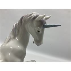 Lladro Privilege figure, Magical Unicorn, modelled as a unicorn with a raised front hoof, sculpted by  Joan Coderch, with original box, no 7697, year issued 2002, year retired 2004, H22cm