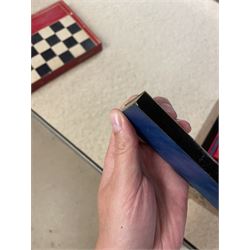 19th century walnut and brass bound games compendium box, painted to enhance the grain, of rectangular form, the hinged opening cover with rounded sides, central brass cartouche with engraved lion crest, and brass riveted straps, opening to reveal a red leather and blue silk lined compartmented interior, with fold-down games board, and lift-out tray containing playing cards, ebony turned dice towers, white and red stained bone draughts, and chess pieces, ivory dice, and ivory and ebony whist markers, and brass bezique board, cribbage board and markers, H15cm W32cm D24cm
This lot has been registered for sale under Section 10 of the APHA Ivory Act