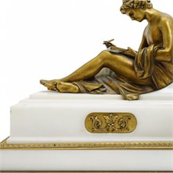 French- Fine early 20th century 8-day white marble mantle clock, on a rectangular stepped plinth with recessed brass banding and inset oval brass panels with raised scroll and leaf decoration, drum cased Parisian  movement flanked by a pair of seated cast brass figures taken from classical antiquity, with a convex white enamel dial and glazed cast brass bezel, Arabic numerals and minute markers with matching pierced brass hands, twin train going barrel movement with a recoil anchor escapement and rack striking, sounding the hours and half hours on a bell. With pendulum.  