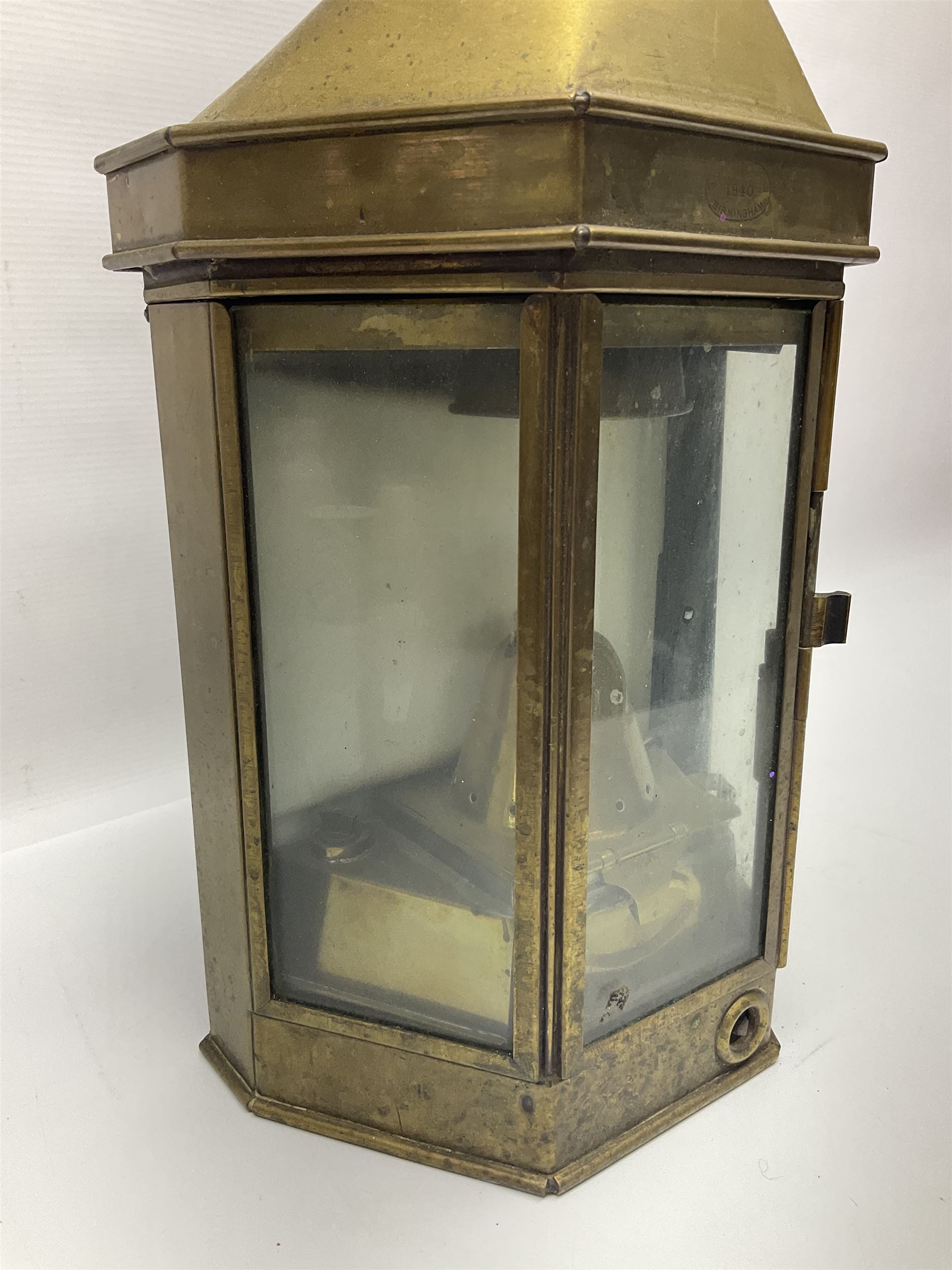 Large brass maritime lamp by Griffiths & Sons Birmingham with swing handle, threaded mounting bracket and associated oil burner, H41cm excluding handle