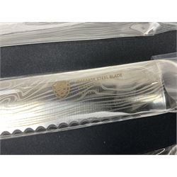 Two cased Swiss knife sets