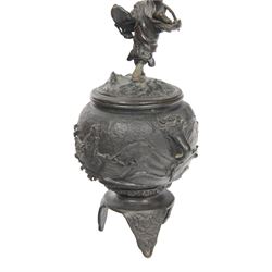 Pair of Japanese bronze koro, raised upon three feet, he body of the koro decorated with figures and animals, the cover mounted with figures, H24cm