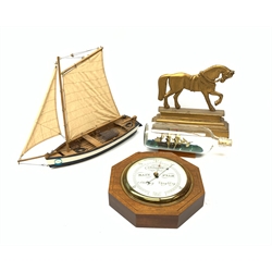 Short & Mason of London aneroid barometer in an octagonal inlaid mahogany case together with a brass door stop in the form of a horse, ship in a bottle and model sailboat (4)