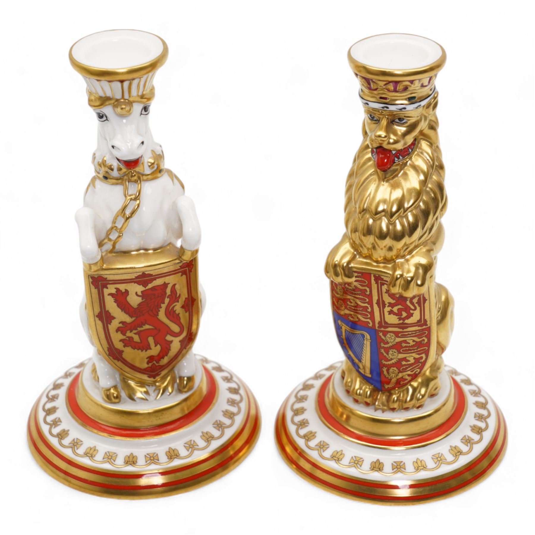 Pair of Minton porcelain heraldic beast candlesticks in the form of a lion and unicorn, limited edition 153/250, for the Silver Jubilee of HM The Queen, H16cm