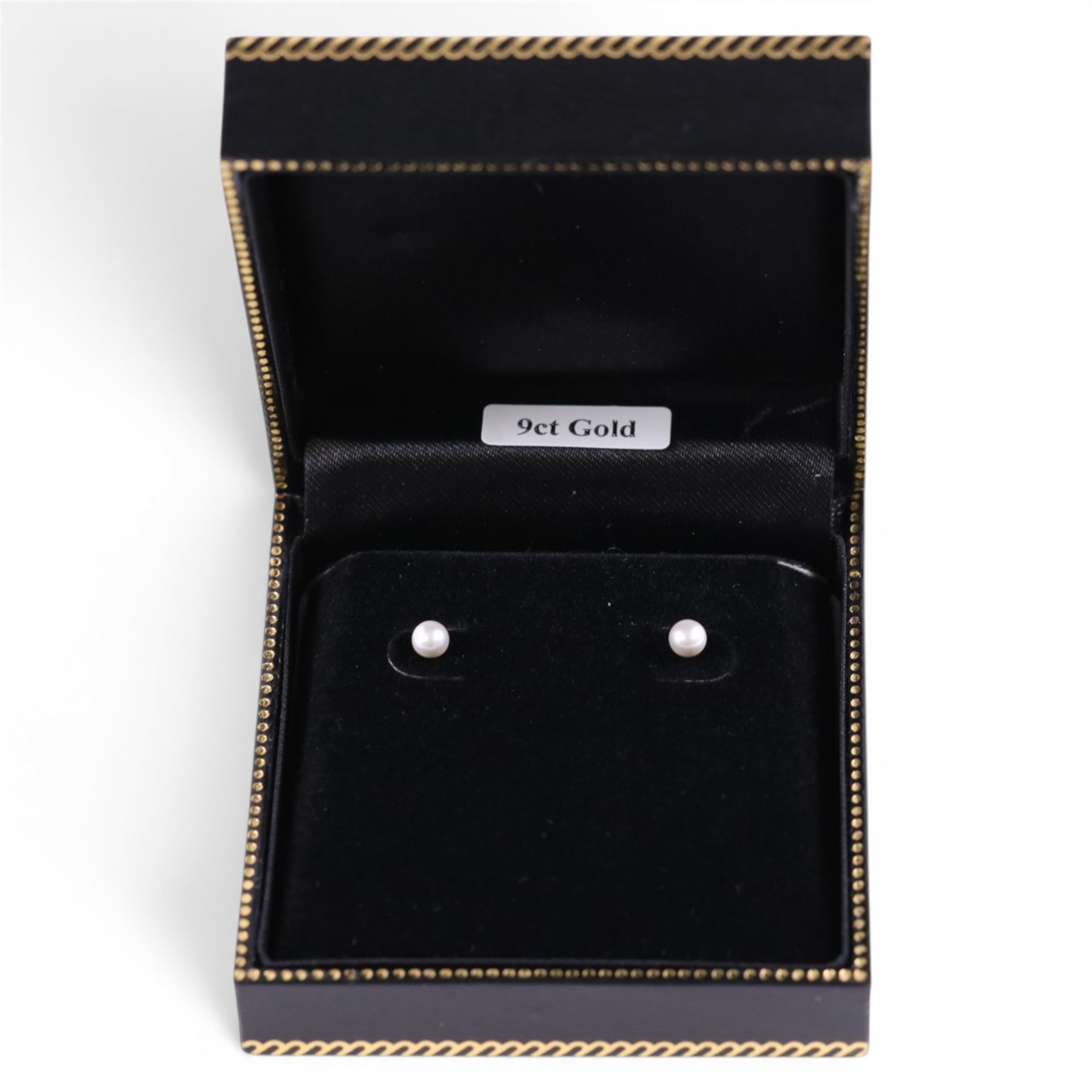 Pair of 9ct gold pearl stud earrings, boxed