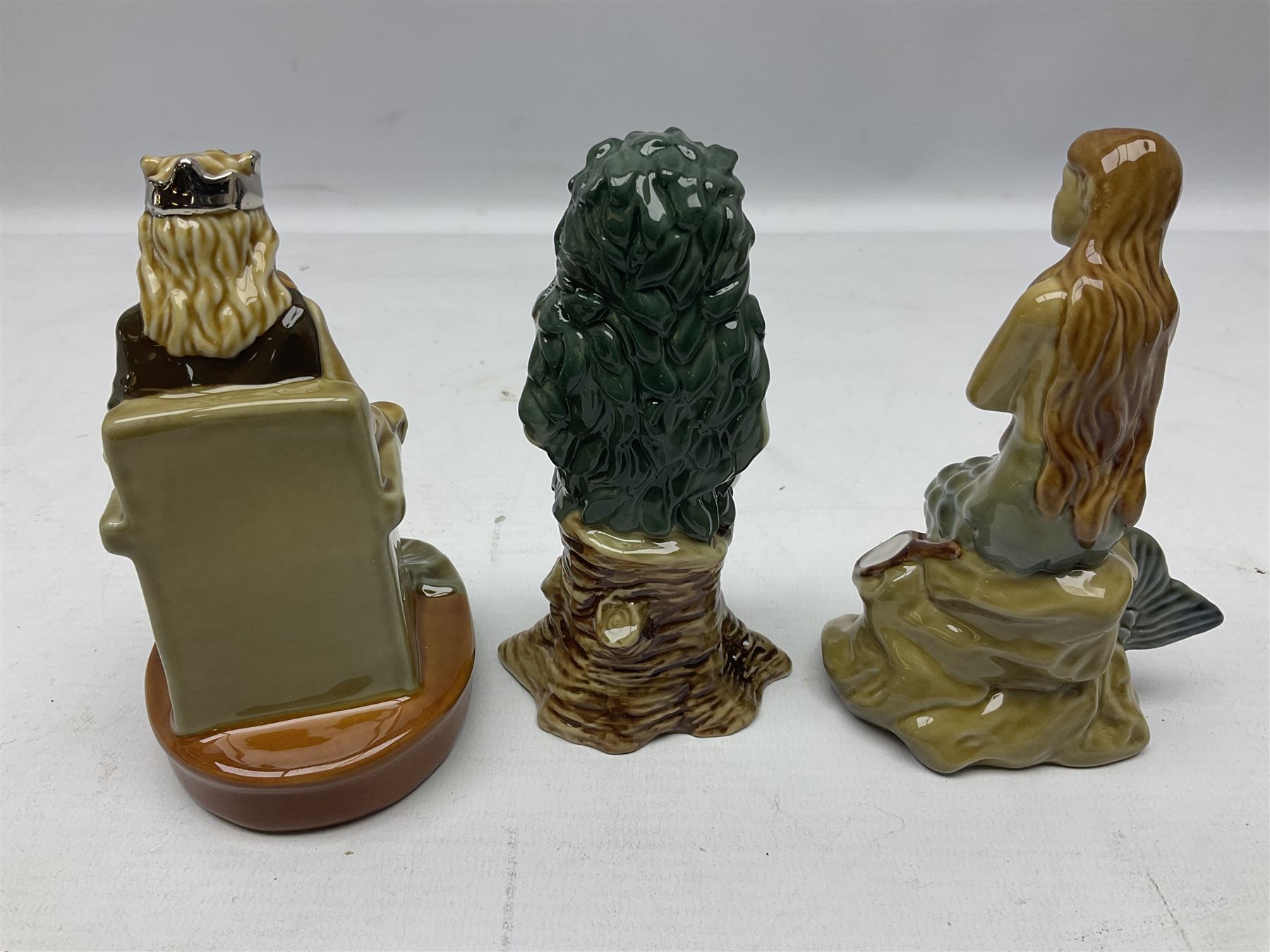Nine Wade Collectables figures, comprising six Myths and Legends; King Canute, Mermaid, St George, Cornish Tin Mine Pixie, Puck and Green man, together with Lamb, Elephant and bear, a Wade Panda money box and two boxes of Wade Christmas Crackers