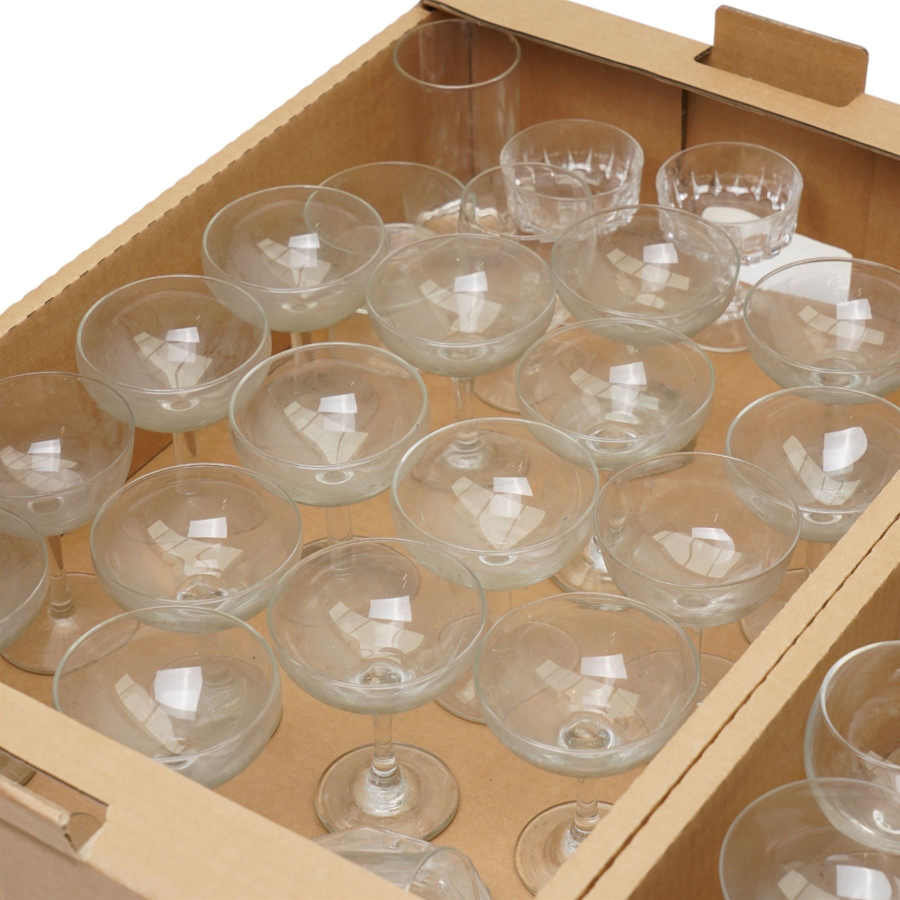 Quantity of table glass including champagne saucers, wine glasses etc