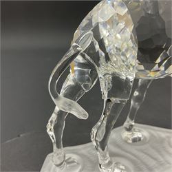 Swarovski Crystal animals, comprising camel and lion, both upon frosted crystal bases, together with Swarovski Crystal palm tree, upon similar frosted crystal base, tallest H14cm