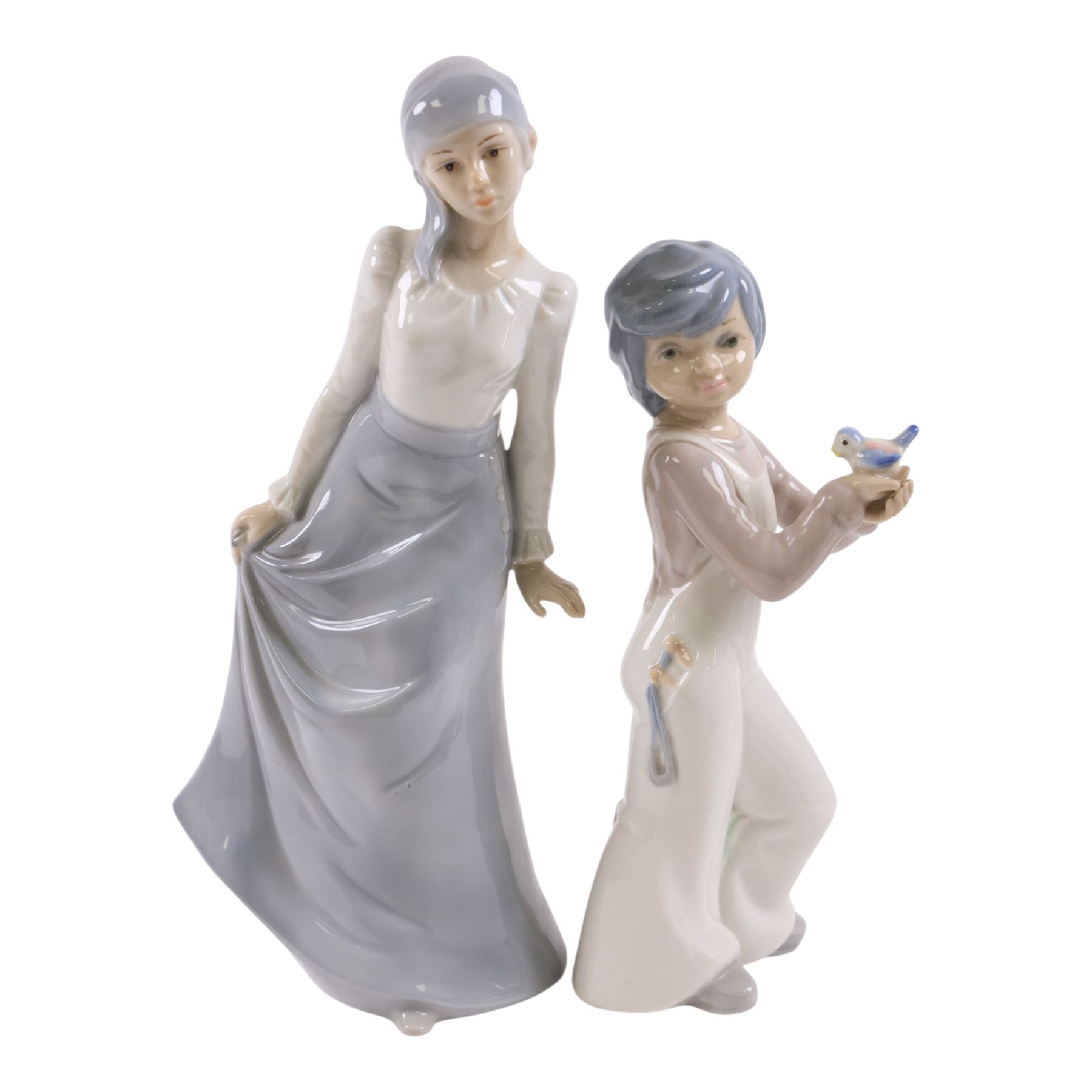 Two Lladro figures, Girl with Calla Lilies and Girl Feeding Goose, together with two other similar figures  