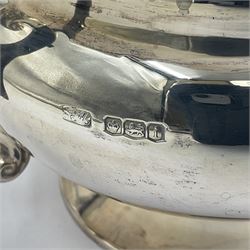 1920s five-piece silver tea service, comprising teapot, coffee pot, hot water pot, twin handled open sucrier and milk jug, each of squat circular form with shaped rim, the teapot, coffee pot and hot water pot each with ebonised handle and finial, the sucrier and milk jug with acanthus capped scroll handles, all upon circular foot, hallmarked R F Mosley & Co, Sheffield 1926 & 1927, tallest H24cm