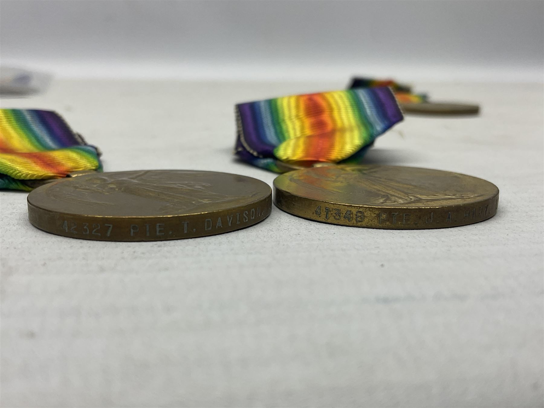 Five WW1 Lincolnshire Regiment Victory Medals awarded to 42327 Pte. T Davison; 29878 Pte. J.W. Simpson; 21702 Pte. H. Archer; 41348 Pte. J.A. Hart; and 9874 Pte. N. Ellis; some biographical information; all with ribbons (5)