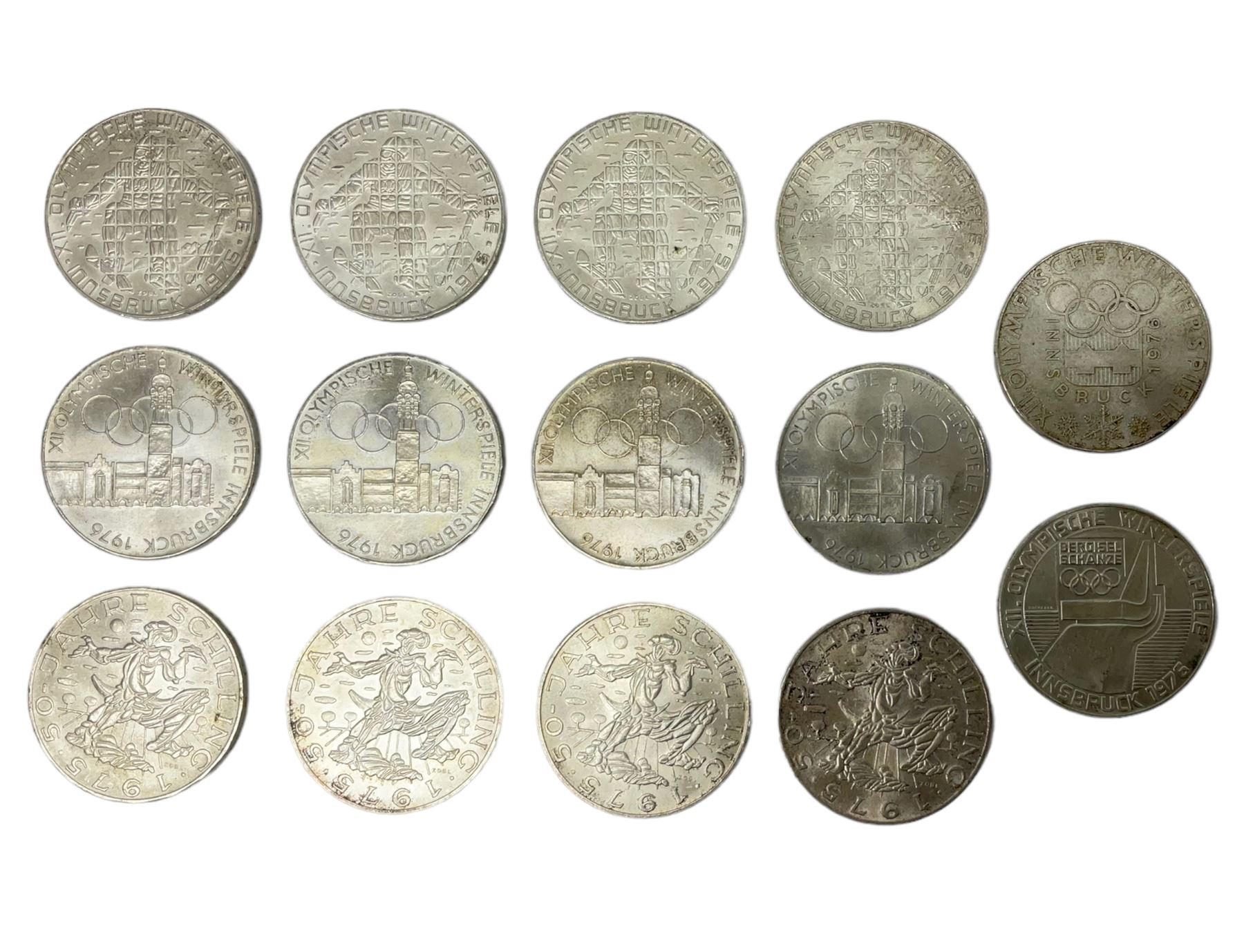 Fourteen Austria silver 100 Schilling coins, four dated 1975 and ten dated 1976, commemorating The 1976 Winter Olympic games