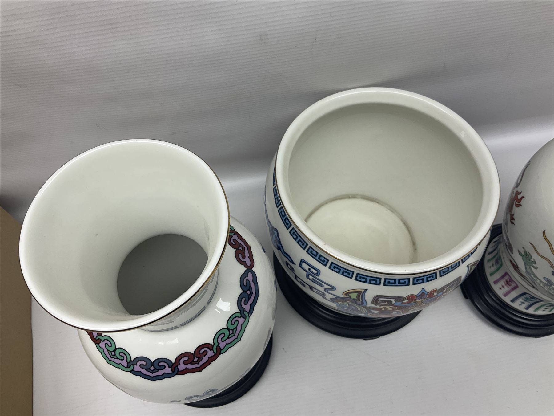 Franklin Mint Chinese style ceramics, comprising two vases, puppy and a planter, all on wooden stands