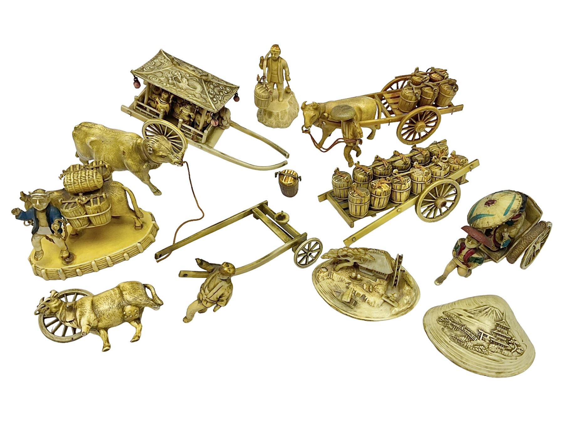 Collection of Japanese celluloid figures, including Rickshaw groups, fishing scene, oxen etc 