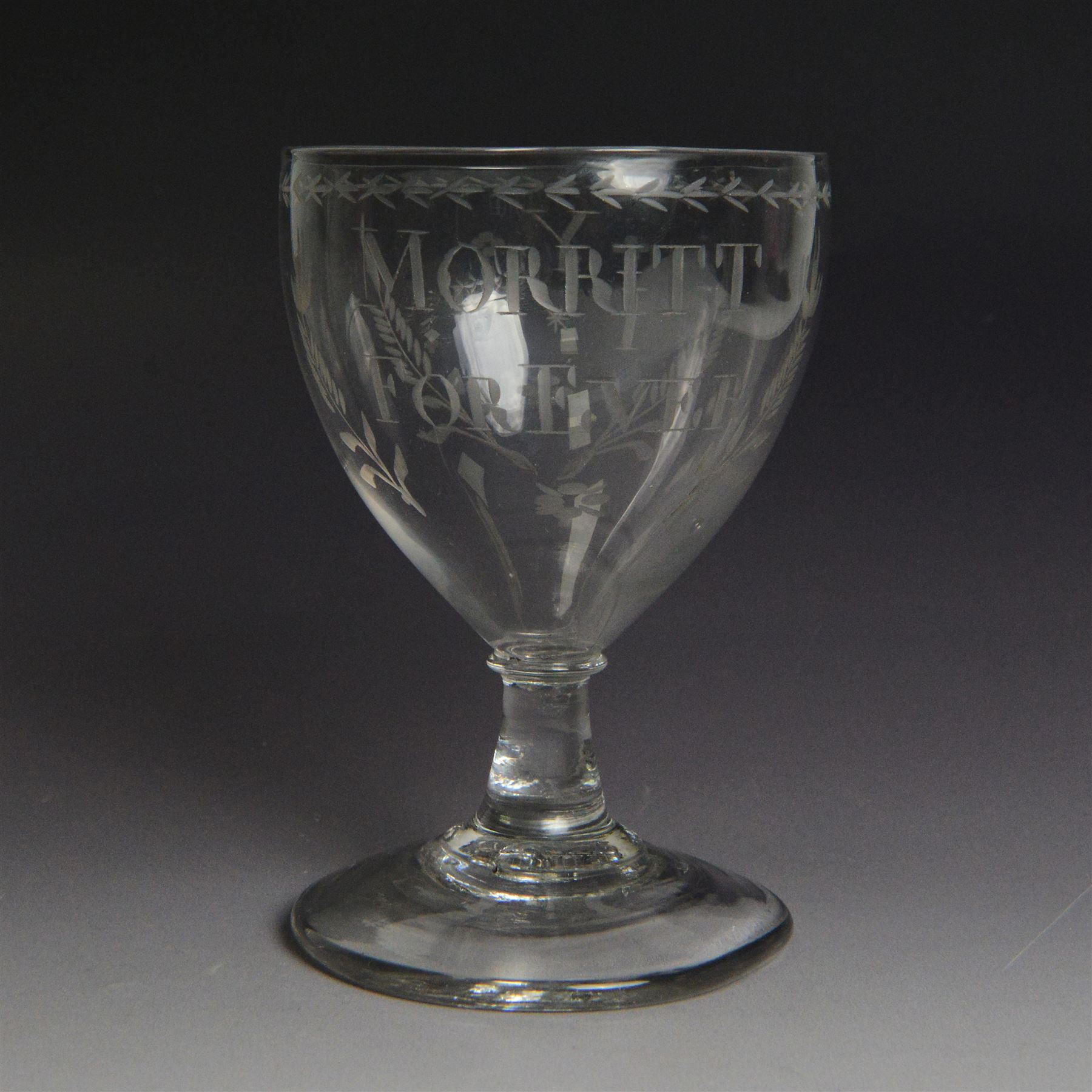 CH SALE 2026 - Dutch engraved Newcastle light baluster glass, circa 1760, the funnel bowl engraved with a two storey country house and church flanked by trees, beneath the inscription ‘T WELVAREN VAN LANDT ENKERK’ (The prosperity of the Country and Church), upon a multi knopped stem with beaded knop and basal knop, over conical foot, H18cm



