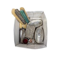 Group of silver, comprising four silver mounted clothes brushes, bible cover, glass bottle with silver lid, five stainless steel ivorine handled knives with silver ferrules, hallmarked and silver plated items