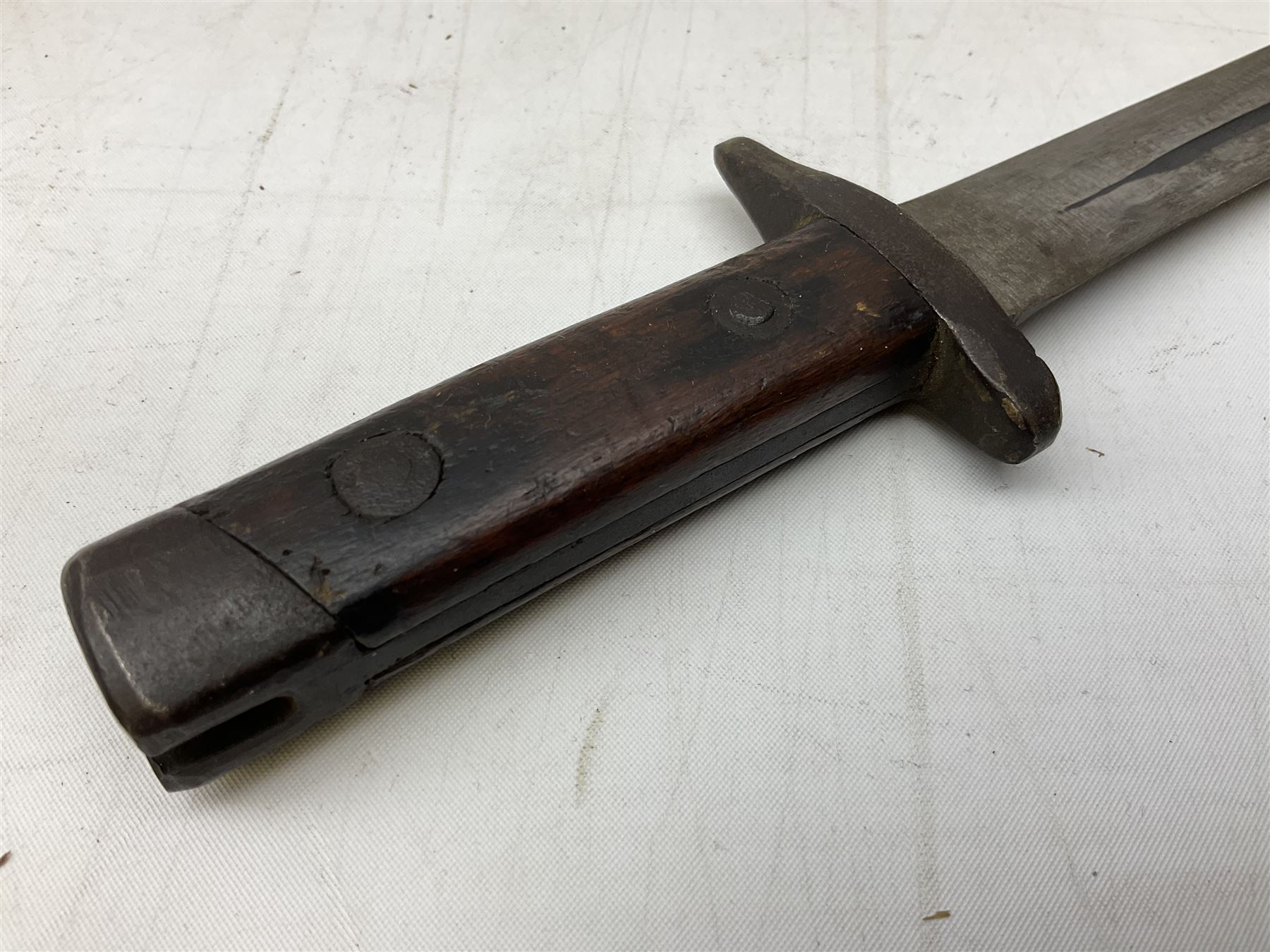 Italian Model 1891 Carcano knife bayonet with 30cm fullered steel blade, the cross-piece stamped VL1110; in steel scabbard with webbing frog L43cm overall; and another Italian fighting knife/bayonet in brass bound leather scabbard (2)