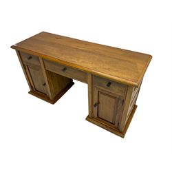 Hardwood twin pedestal desk, fitted with three drawers and two cupboards