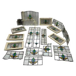1930s external door with stained leaded glass panel (86cm x 203cm), six small stained glass windows in wooden frames (W52cm); and various loose stained leaded glass panels