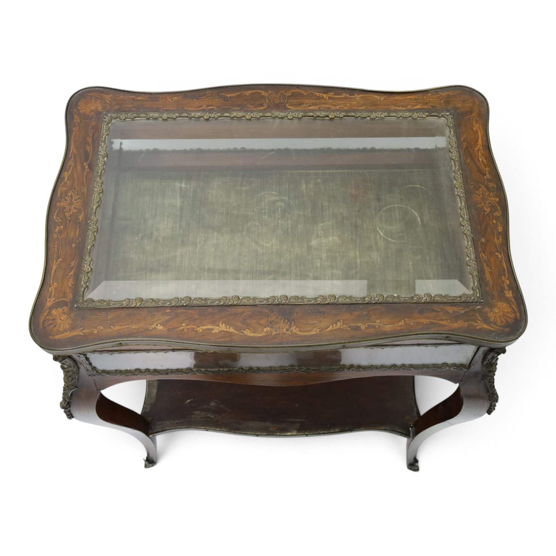 Louis XV style rosewood and marquetry bijouterie table,  glazed hinged top within a floral marquetry border and gilt metal moulded edge, above glazed sides and a baize lined interior, raised on cabriole legs with gilt metal mounts and sabots, united by an undertier