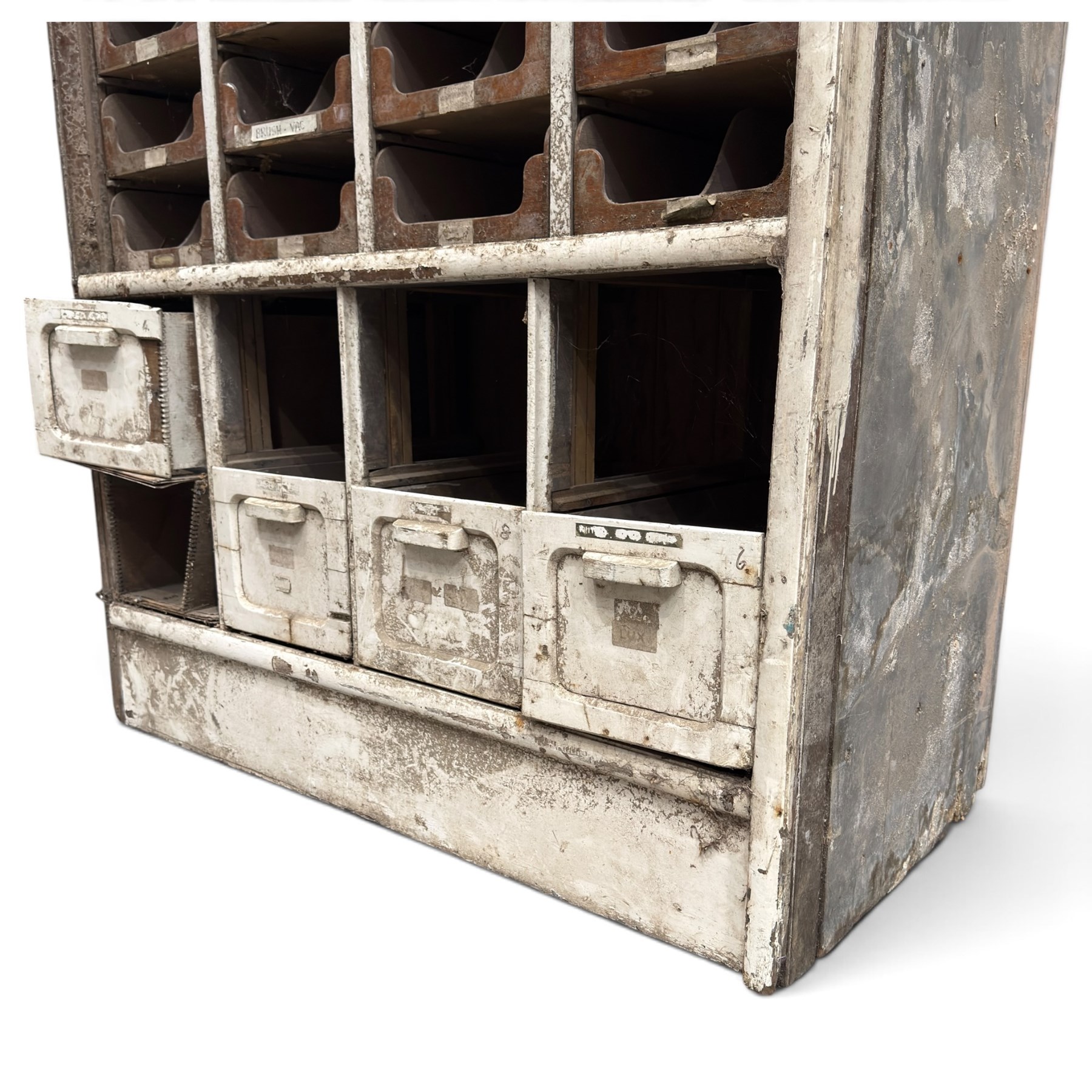 F Pollard & Co - late 19th century rustic haberdashery shop cabinet, fitted with an assortment of forty sliding trays, with drawers fitted to base, in antique white-painted finish