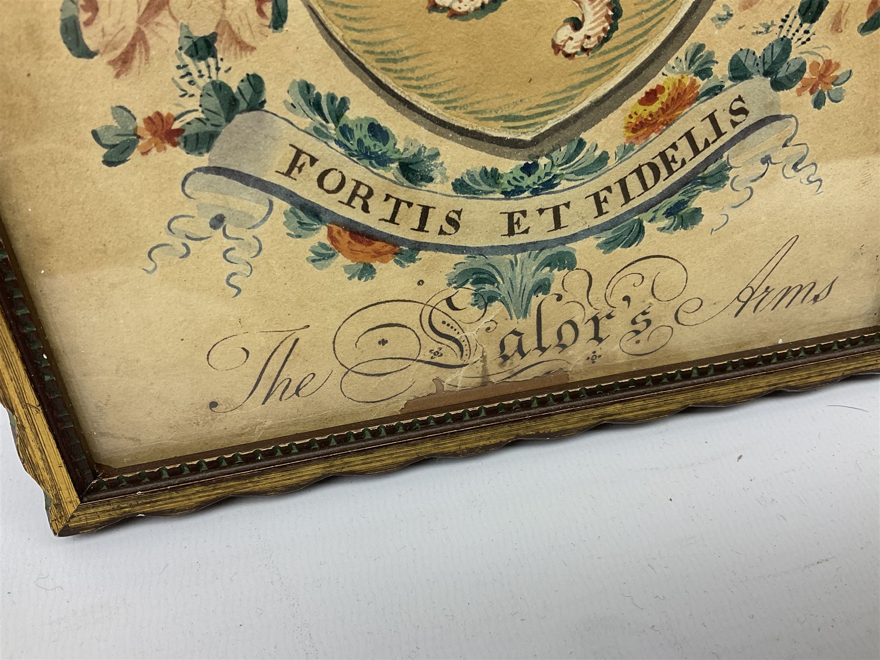 19th century heraldic watercolour depicting 'The Salor's Arms', lion rampant within a shield beneath a knight's helmet, embellished with floral and scrolling decoration, inscribed with family motto 'Fortis et Fidelis' (Strong and Faithful) 