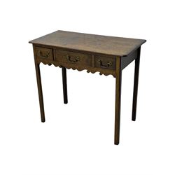 18th century oak lowboy, rectangular moulded top over three frieze drawers with brass swing handles, scalloped apron, on slender square section supports