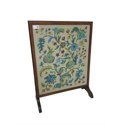Late 20th century beech framed fire screen, with floral needle work panel
