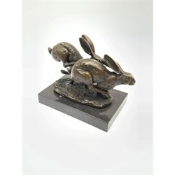 Bronze figure group, modelled as two hares in chase, signed Nick and with foundry mark, raised upon a rectangular marble base, H12cm overall